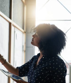 Shot of a young female designer working in her office